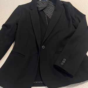 Beautiful black blazer size medium has a nice stretch to it slightly used